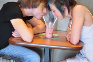 Couple in love enjoying a smoothie at McDonald's